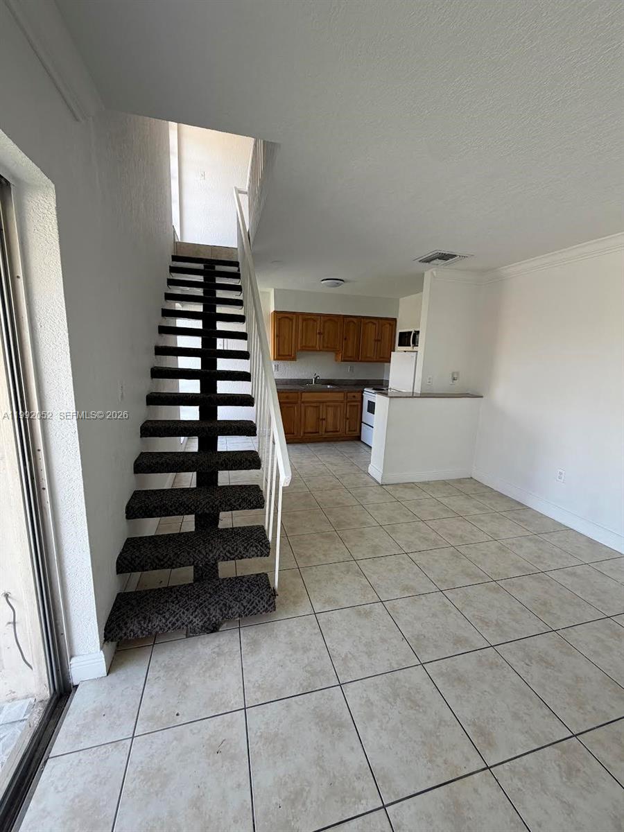 3901 Southwest 109th Avenue, Unit 8 Miami, FL 33165 - Photo 3 of 7 a view of kitchen and utility room