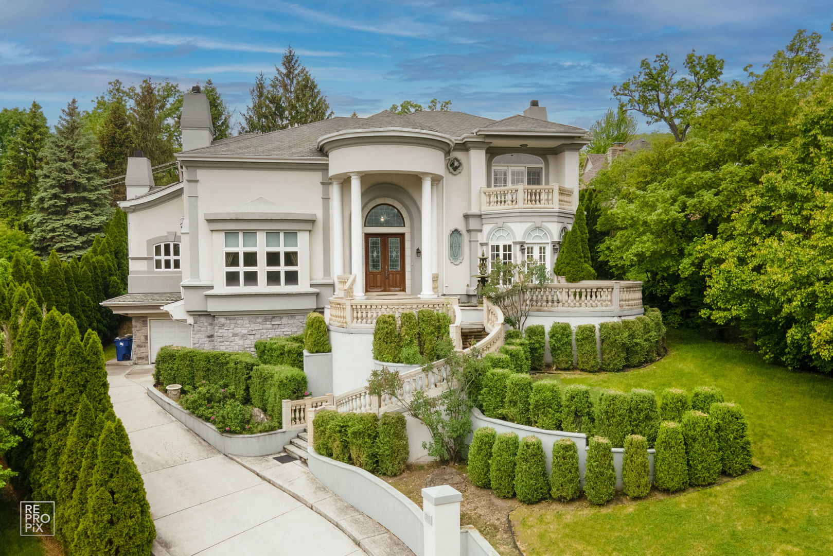a front view of a house with garden