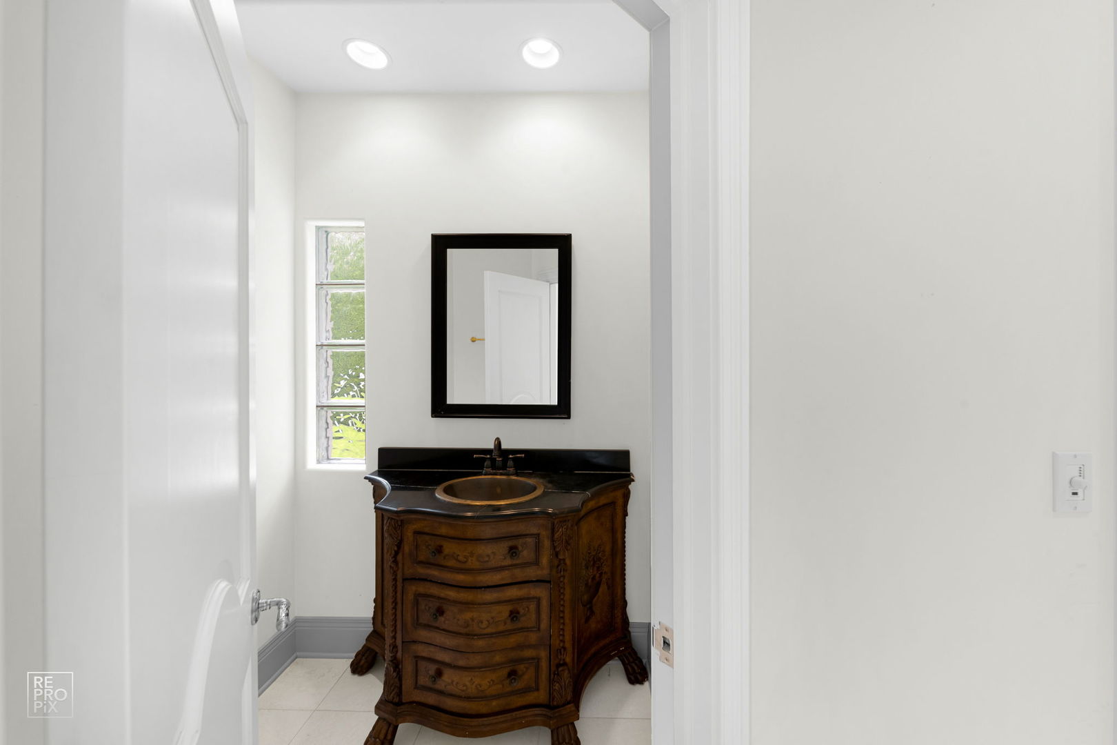 355 Flagg Court Hinsdale, IL 60521 - Photo 19 of 53 a bathroom with a sink and a mirror