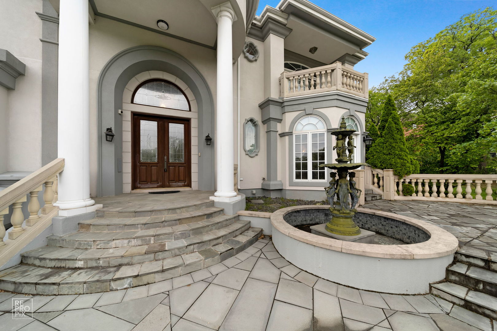 355 Flagg Court Hinsdale, IL 60521 - Photo 47 of 53 a front view of a house with a fountain