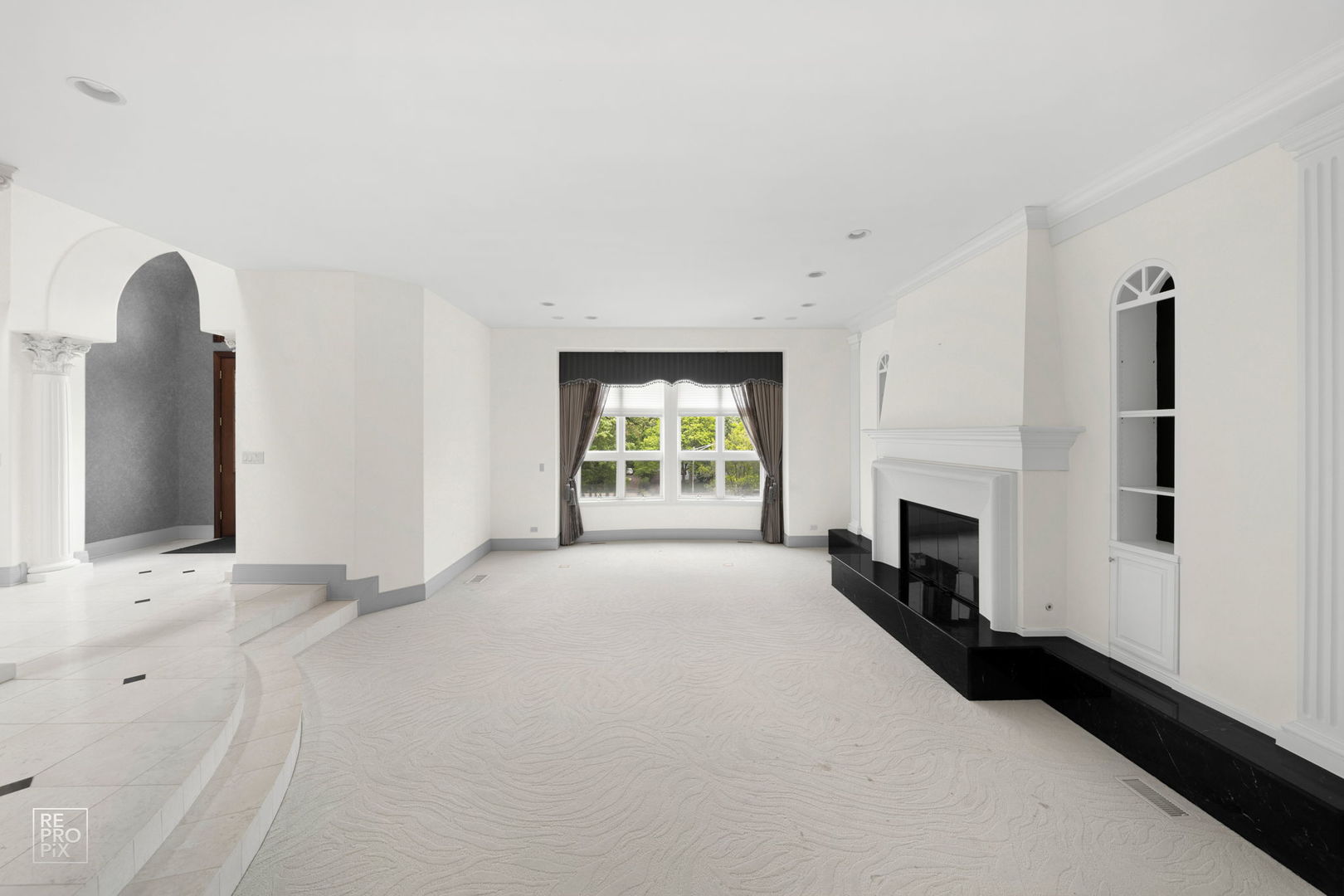 355 Flagg Court Hinsdale, IL 60521 - Photo 8 of 53 a view of an empty room with window and fireplace