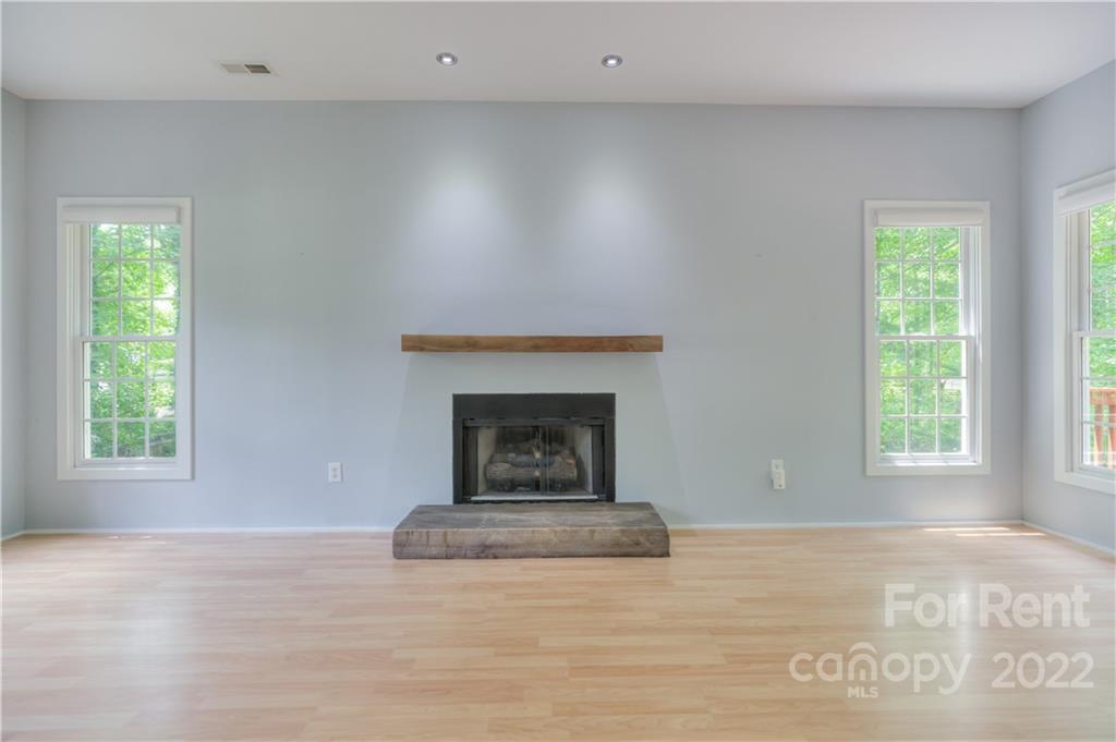 2857 Windsor Chase Drive Matthews, NC 28105 - Photo 11 of 46 a view of empty room with a fireplace