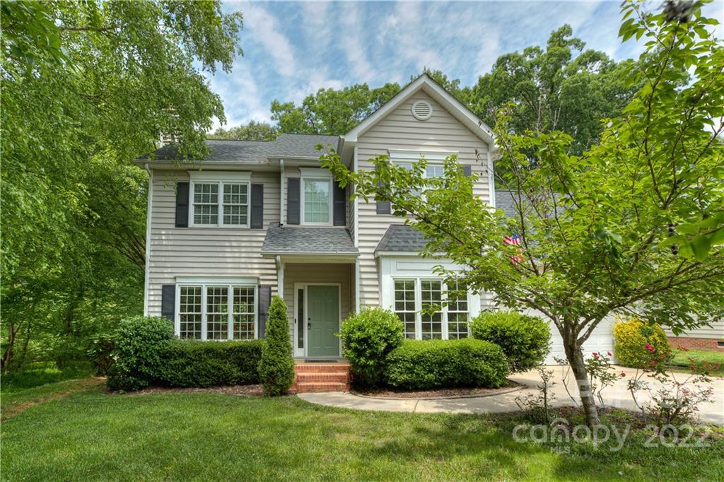 2857 Windsor Chase Drive Matthews, NC 28105 - Photo 2 of 46 a front view of a house with a yard