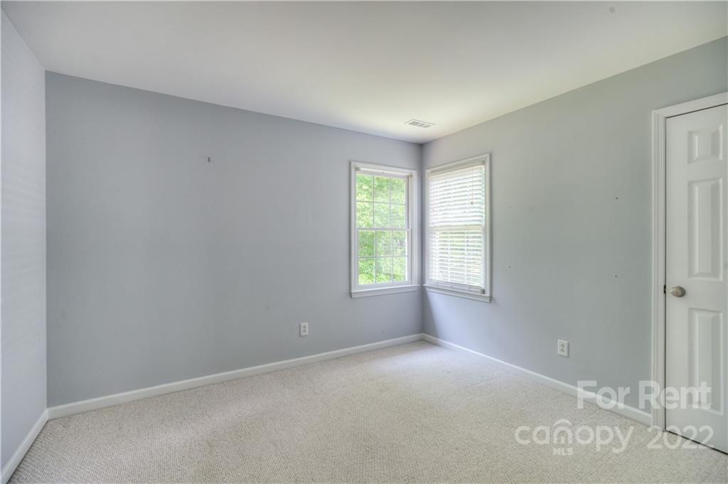 2857 Windsor Chase Drive Matthews, NC 28105 - Photo 28 of 46 an empty room with windows