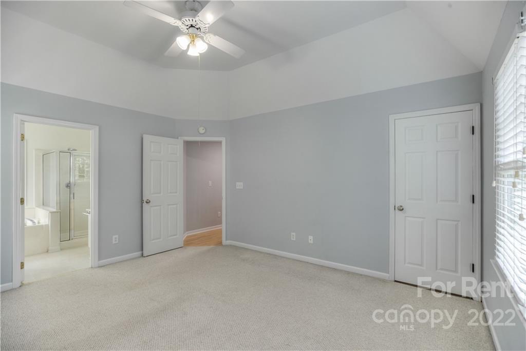 2857 Windsor Chase Drive Matthews, NC 28105 - Photo 32 of 46 a view of an empty room and chandelier fan