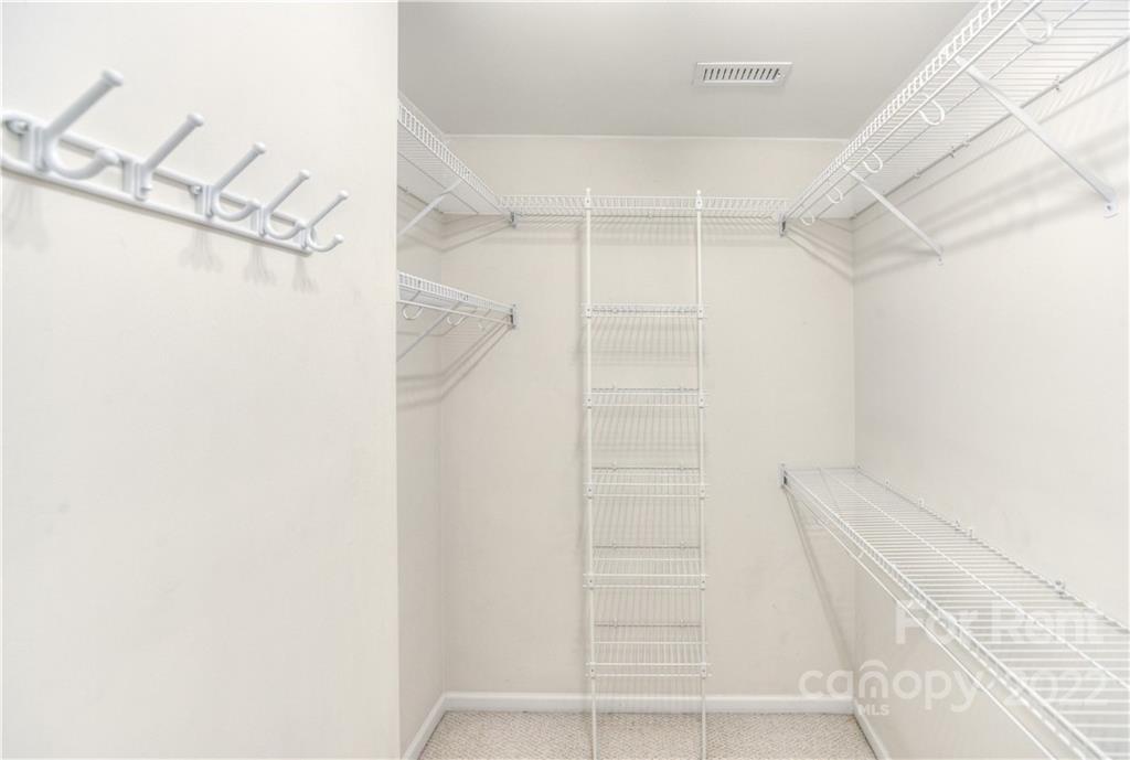 2857 Windsor Chase Drive Matthews, NC 28105 - Photo 37 of 46 a view of walk in closet with empty racks