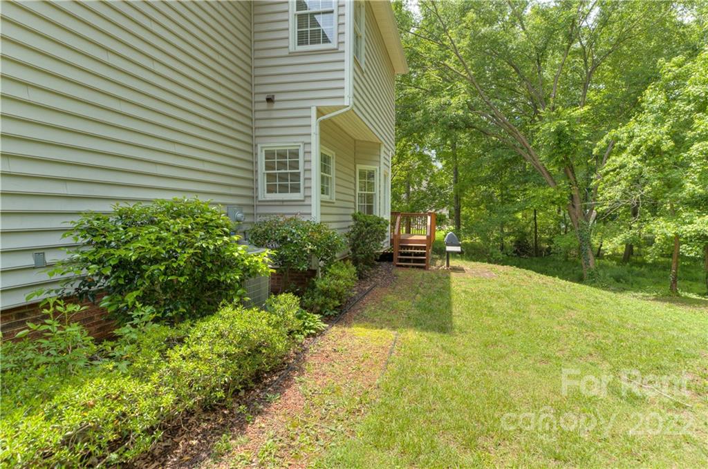 2857 Windsor Chase Drive Matthews, NC 28105 - Photo 45 of 46 a swimming pool with trees in the background