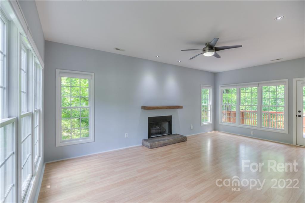 2857 Windsor Chase Drive Matthews, NC 28105 - Photo 8 of 46 a view of an empty room with a window and fireplace