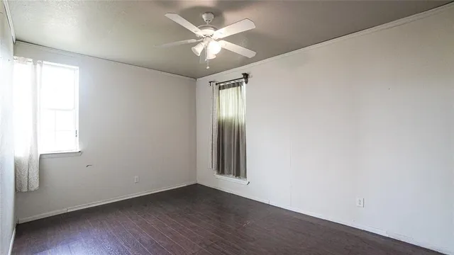 a view of a room with wooden walls