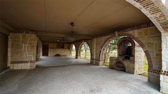 a view of yard with wooden fence