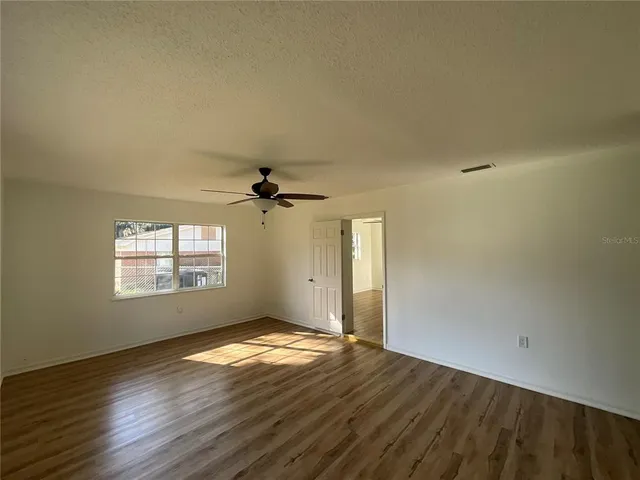 a view of a livingroom with wooden floor