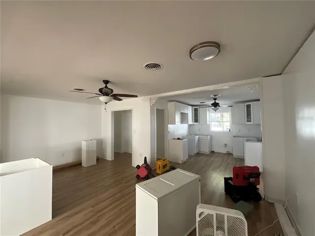 a view of a livingroom with furniture and window
