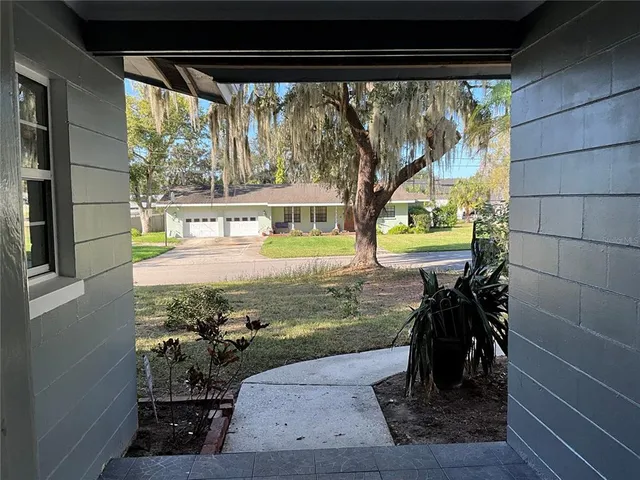 a view of a living room and floor to ceiling window or lake view