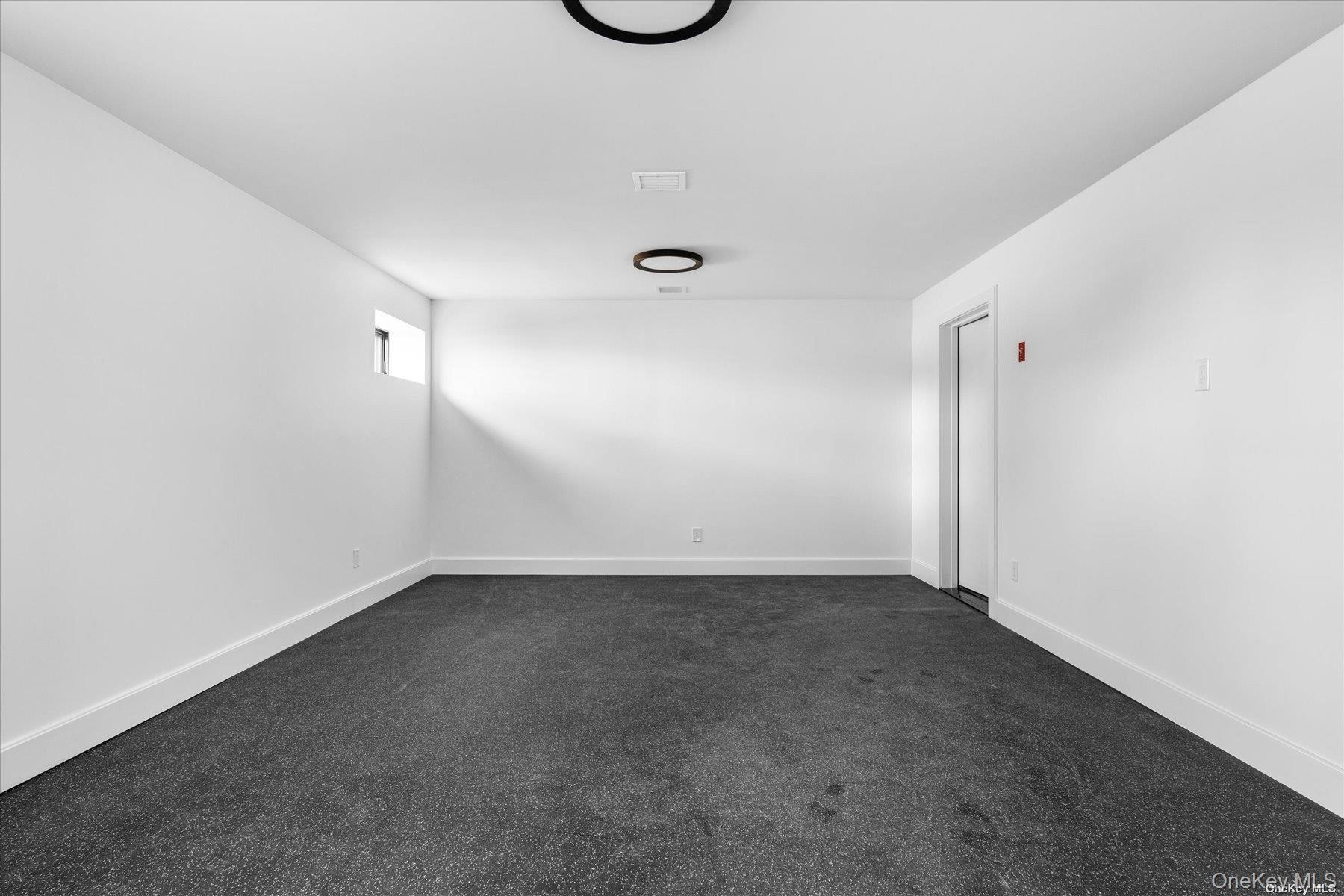 290 Windward Road Orient, NY 11957 - Photo 22 of 31 a view of an empty room with a window