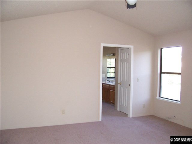 1739 Rainbow Ridge Road Reno, NV 89523 - Photo 7 of 8 an empty room with windows and closet