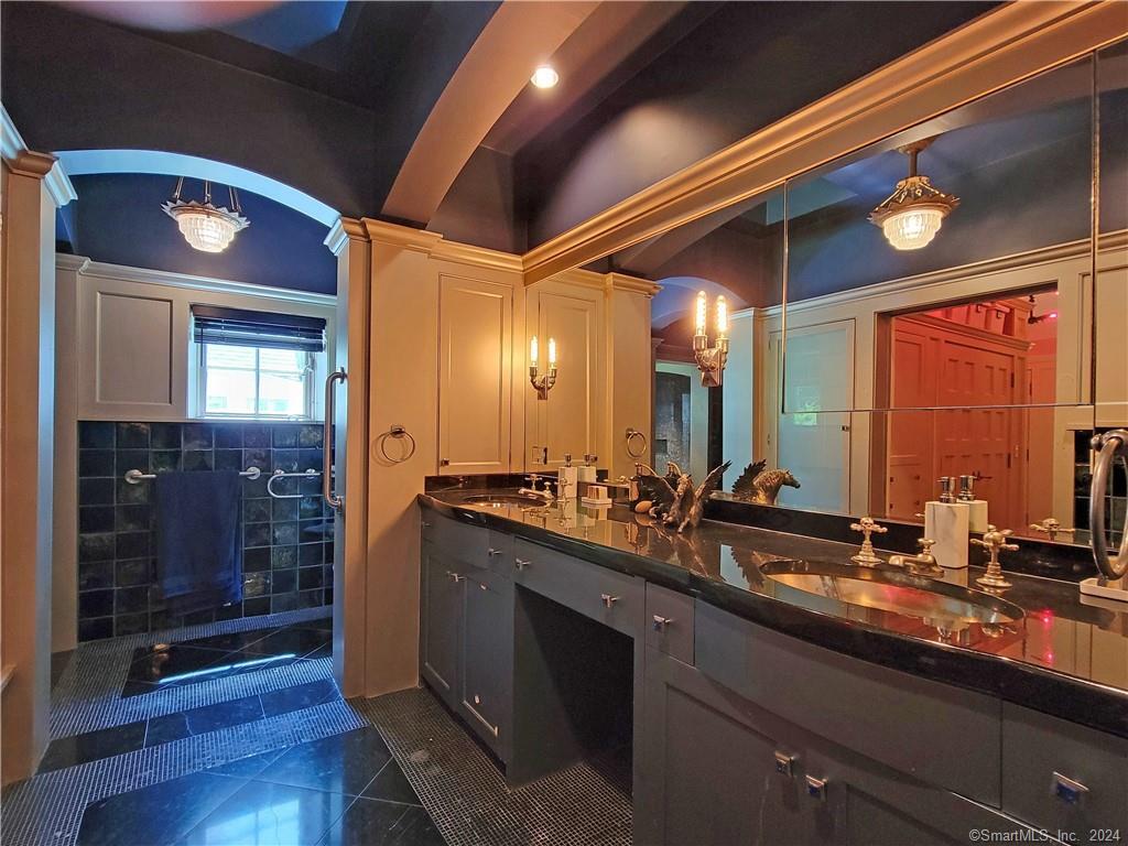 22 Ketcham Road Ridgefield, CT 06877 - Photo 22 of 40 a bathroom with double vanity and a mirror