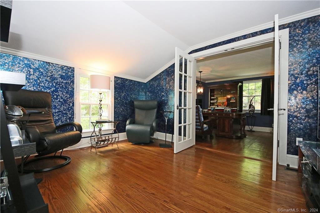 22 Ketcham Road Ridgefield, CT 06877 - Photo 32 of 40 a living room with furniture and a fireplace