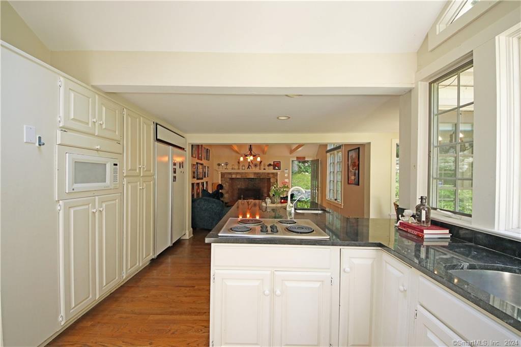 22 Ketcham Road Ridgefield, CT 06877 - Photo 36 of 40 a kitchen with sink refrigerator and large window