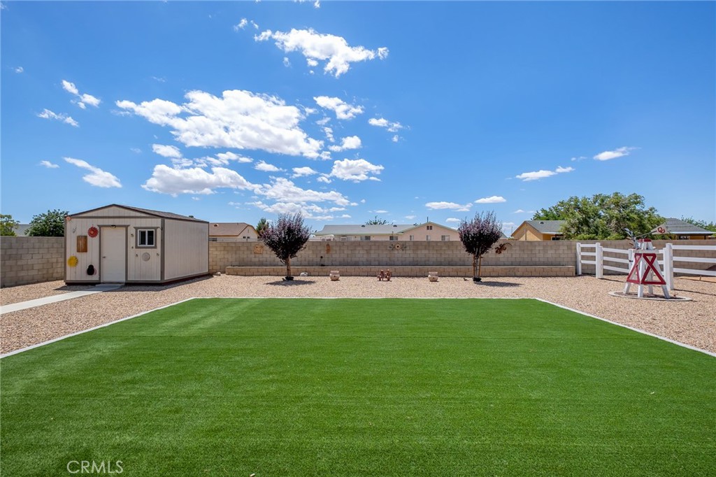 13178 Setancket Road Apple Valley, CA 92308 - Photo 20 of 24 a swimming pool with outdoor seating and yard