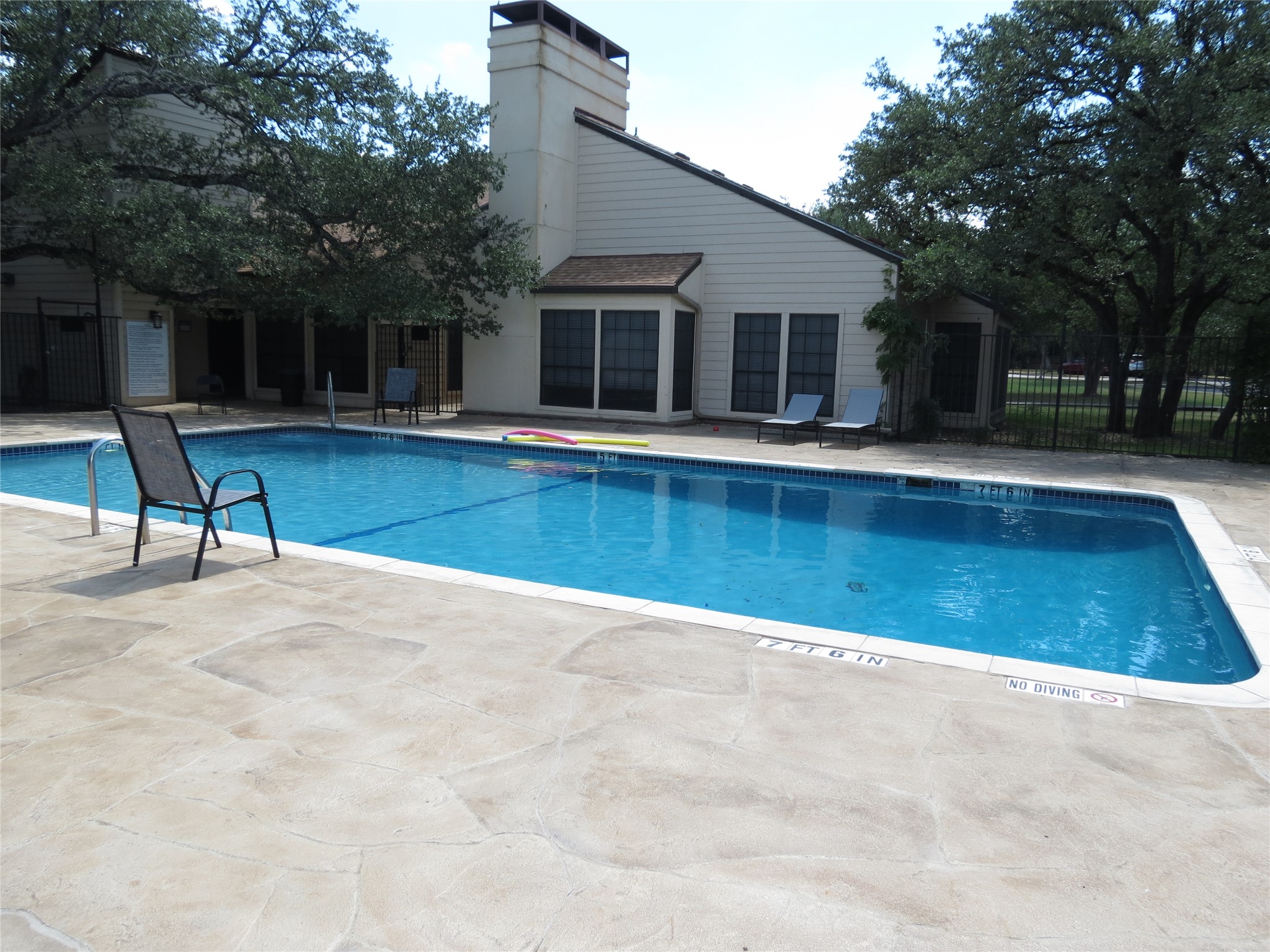4159 Steck Avenue, Unit 269 Austin, TX 78759 - Photo 17 of 21 A sparkling community pool offers a refreshing escape adjacent to the residential building.