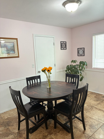 297 West Bricker Road Draper, UT 84020 - Photo 4 of 25 Dining room with baseboards and stone finish floors