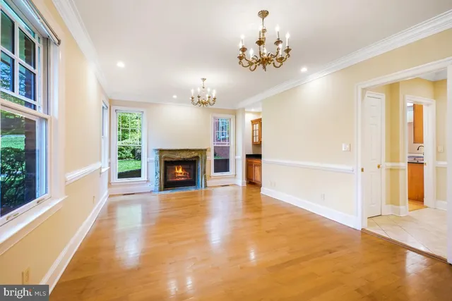 a large kitchen with stainless steel appliances granite countertop a stove a sink and a microwave