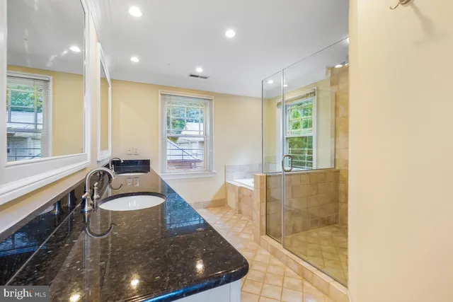 a view of backyard with barbeque grill and wooden fence