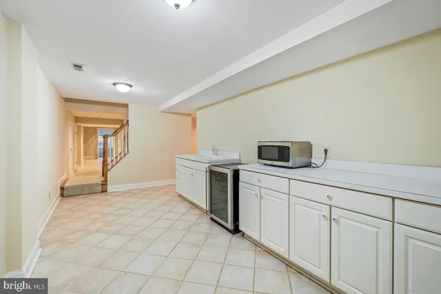 a bathroom with a double vanity sink toilet mirror and shower