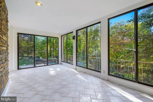 a view of an empty room with glass door
