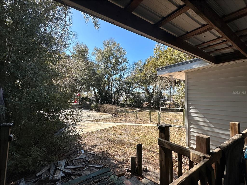 513 West Main Street Wauchula, FL 33873 - Photo 19 of 43 a view of a backyard with sitting area