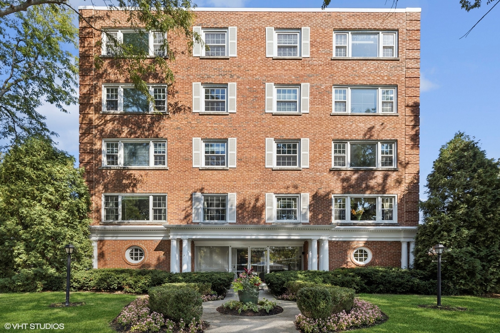 a front view of a building with garden