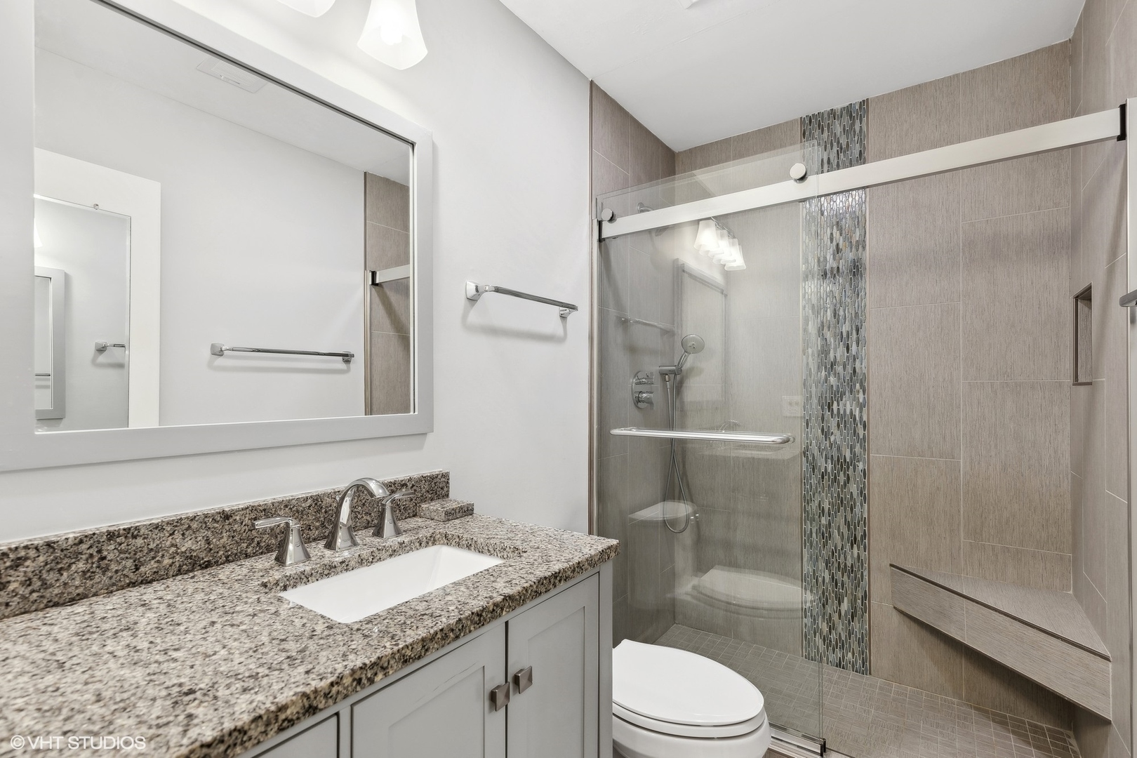 2425 Central Street, Unit 2B Evanston, IL 60201 - Photo 11 of 17 a bathroom with a granite countertop sink toilet and shower