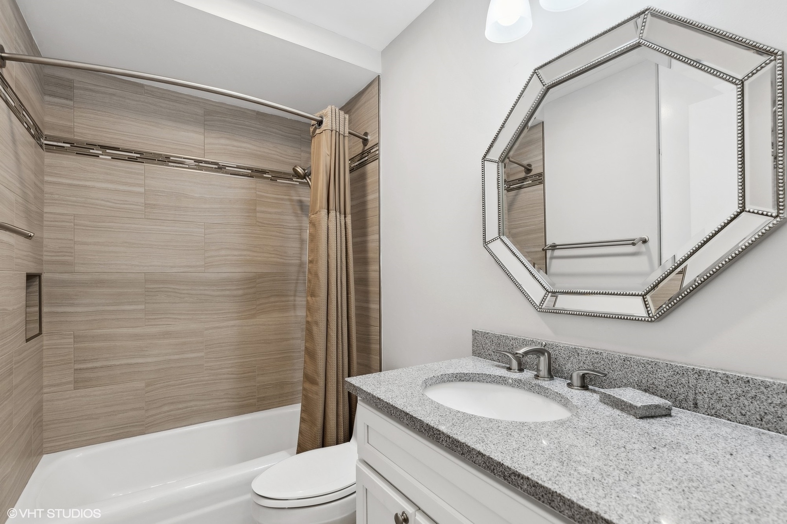 2425 Central Street, Unit 2B Evanston, IL 60201 - Photo 14 of 17 a bathroom with a granite countertop sink toilet and shower
