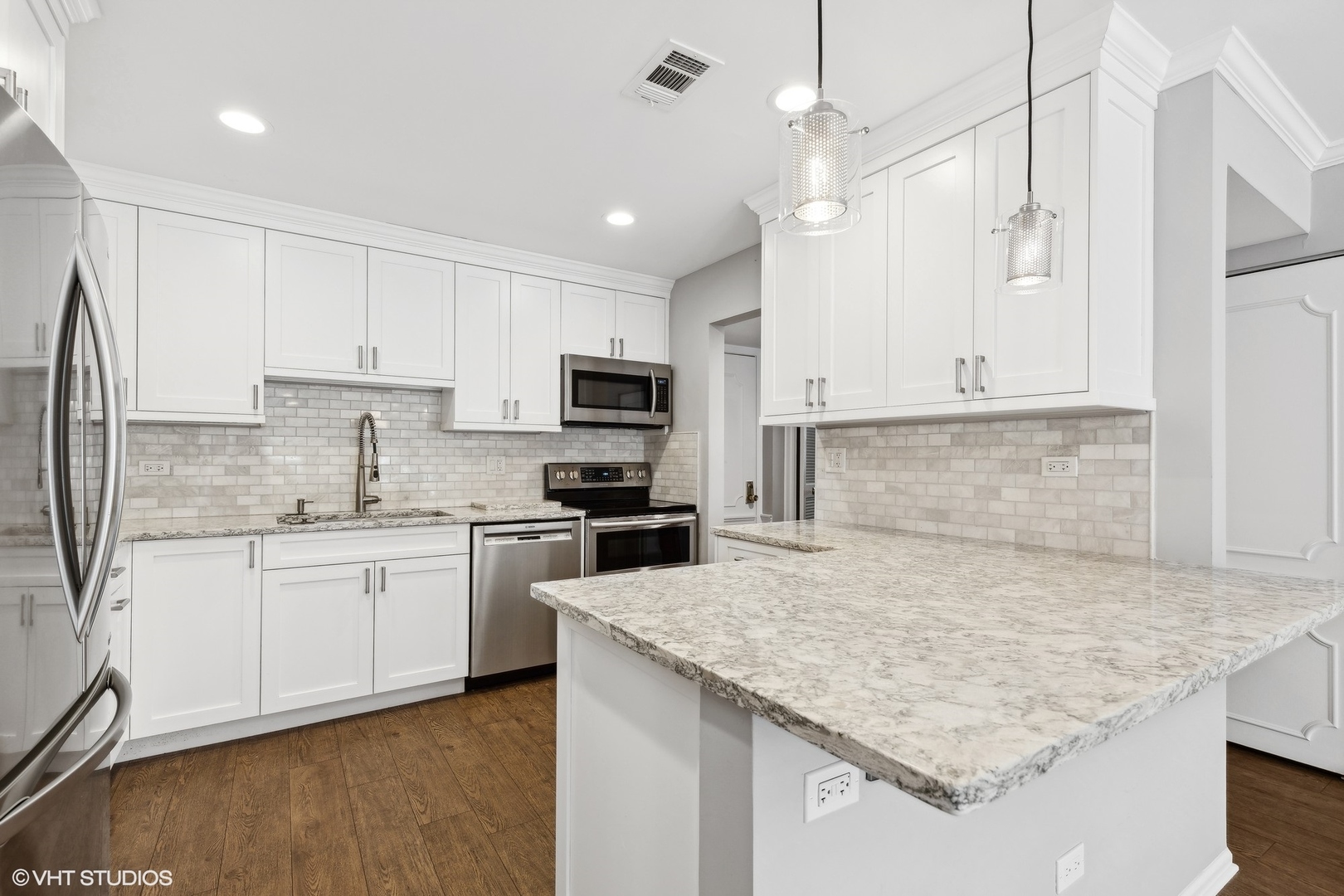 2425 Central Street, Unit 2B Evanston, IL 60201 - Photo 3 of 17 a kitchen with stainless steel appliances granite countertop a sink stove and refrigerator