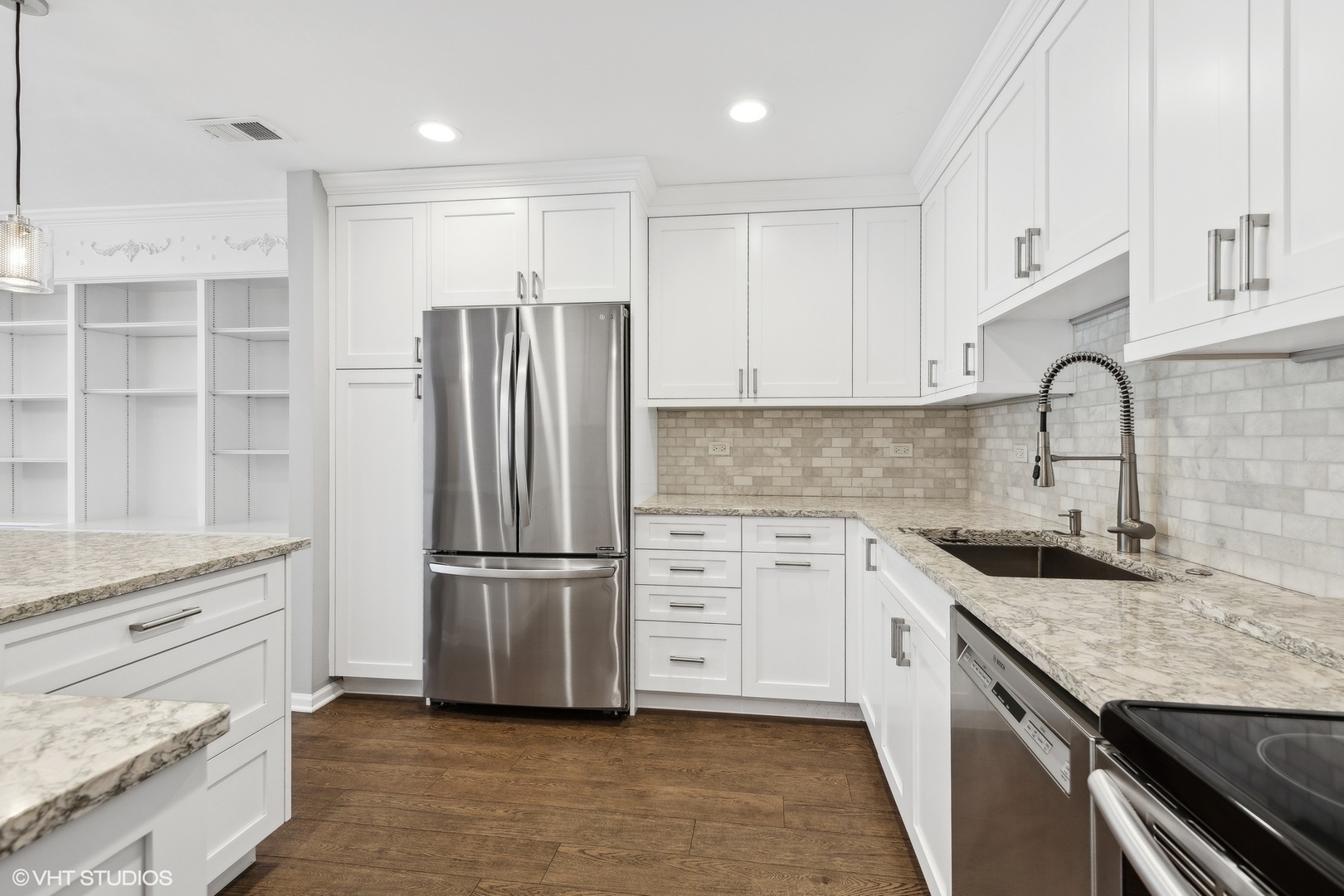 2425 Central Street, Unit 2B Evanston, IL 60201 - Photo 4 of 17 a kitchen with granite countertop a refrigerator stove and sink