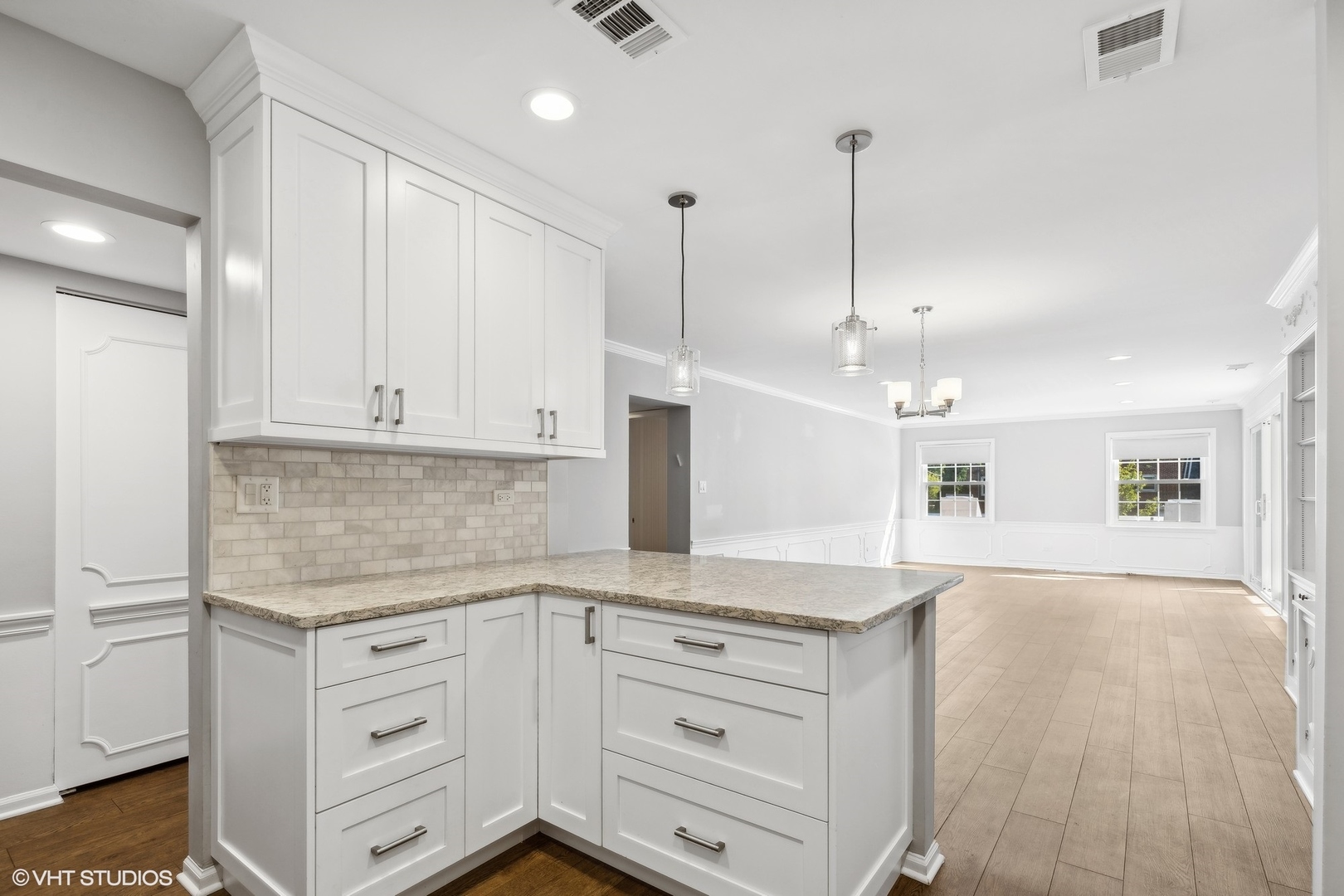 2425 Central Street, Unit 2B Evanston, IL 60201 - Photo 5 of 17 a kitchen with granite countertop white cabinets and white appliances