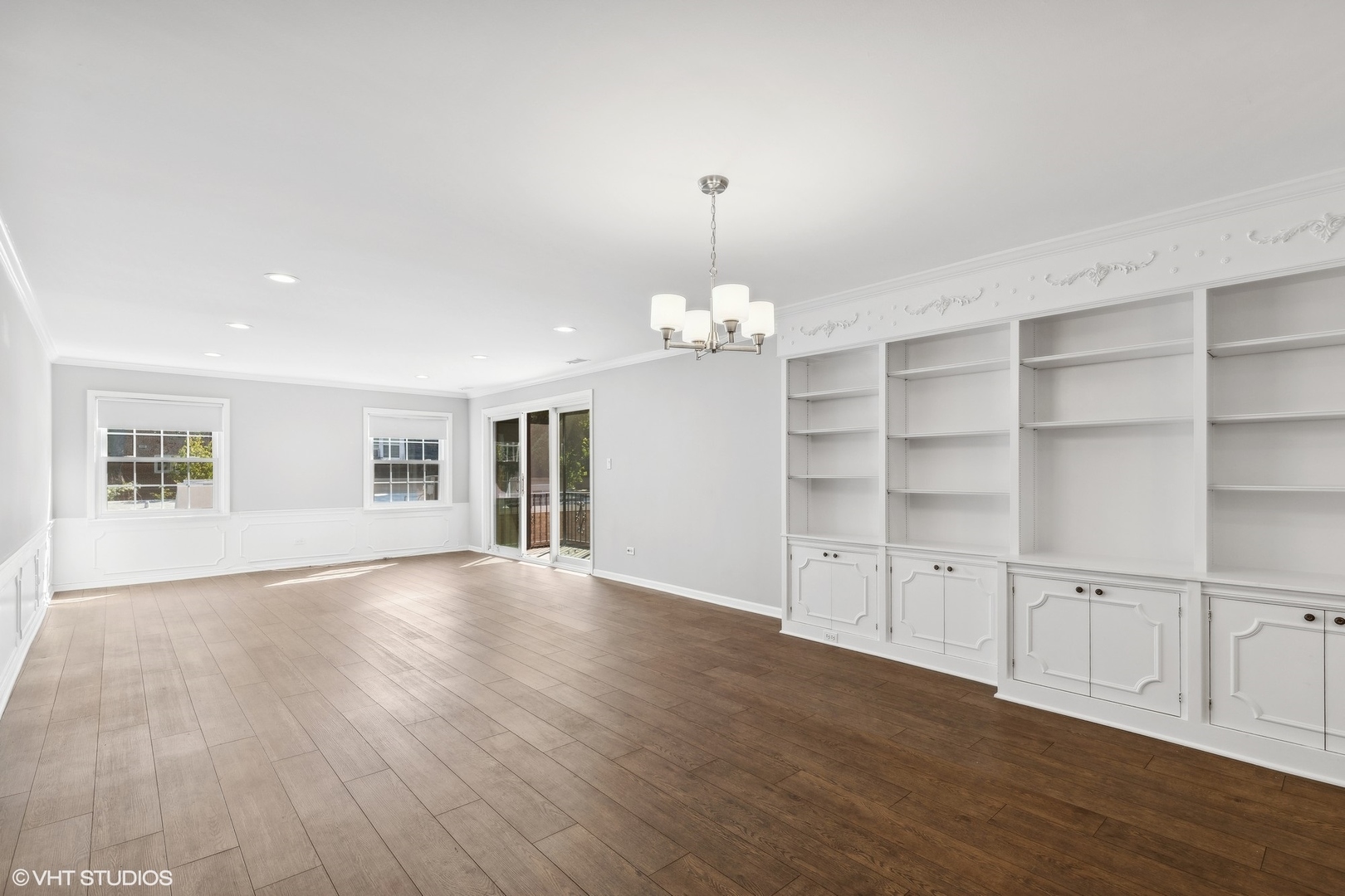 2425 Central Street, Unit 2B Evanston, IL 60201 - Photo 6 of 17 a view of an empty room with a window and wooden floor
