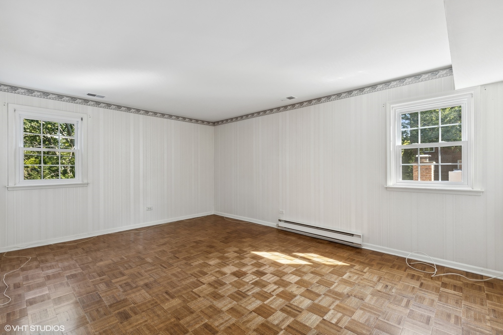 2425 Central Street, Unit 2B Evanston, IL 60201 - Photo 10 of 17 a view of a big room with wooden floor and windows