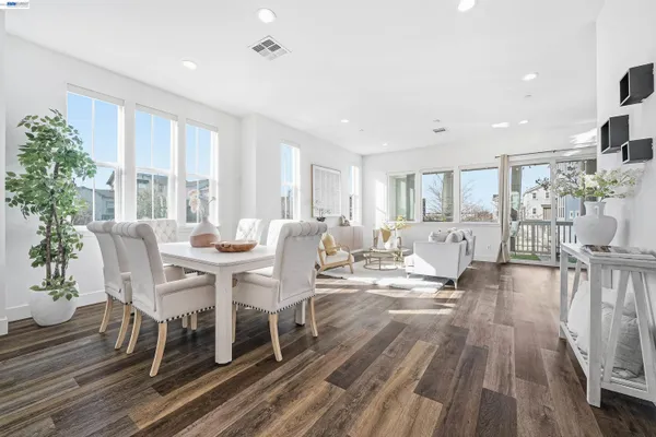 a view of a dining room with furniture window and wooden floor