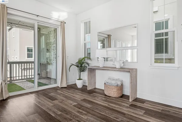 a kitchen with stainless steel appliances granite countertop a sink refrigerator and cabinets