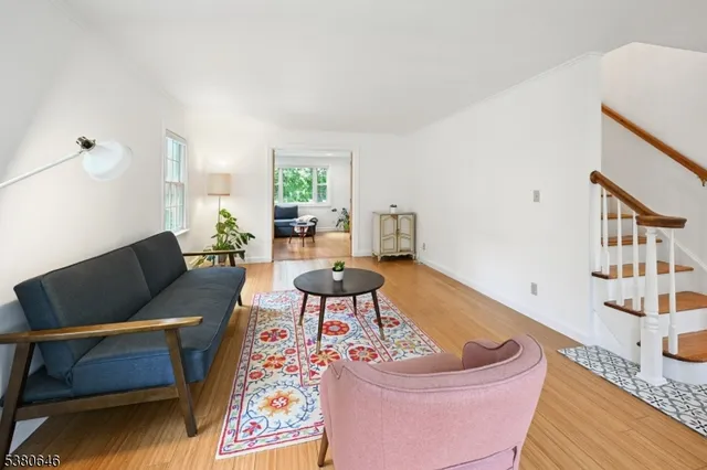 a living room with furniture and a rug
