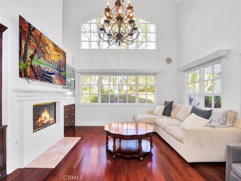 7 Hillcrest Meadows Rolling Hills Estates, CA 90274 - Photo 11 of 49 a living room with furniture a fireplace and a flat screen tv