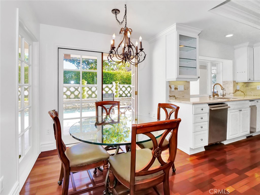 7 Hillcrest Meadows Rolling Hills Estates, CA 90274 - Photo 16 of 49 a dining room filled chandelier and wooden floor