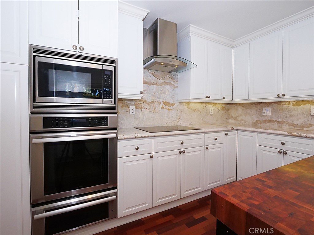 7 Hillcrest Meadows Rolling Hills Estates, CA 90274 - Photo 17 of 49 a kitchen with granite countertop cabinets stainless steel appliances and wooden floor