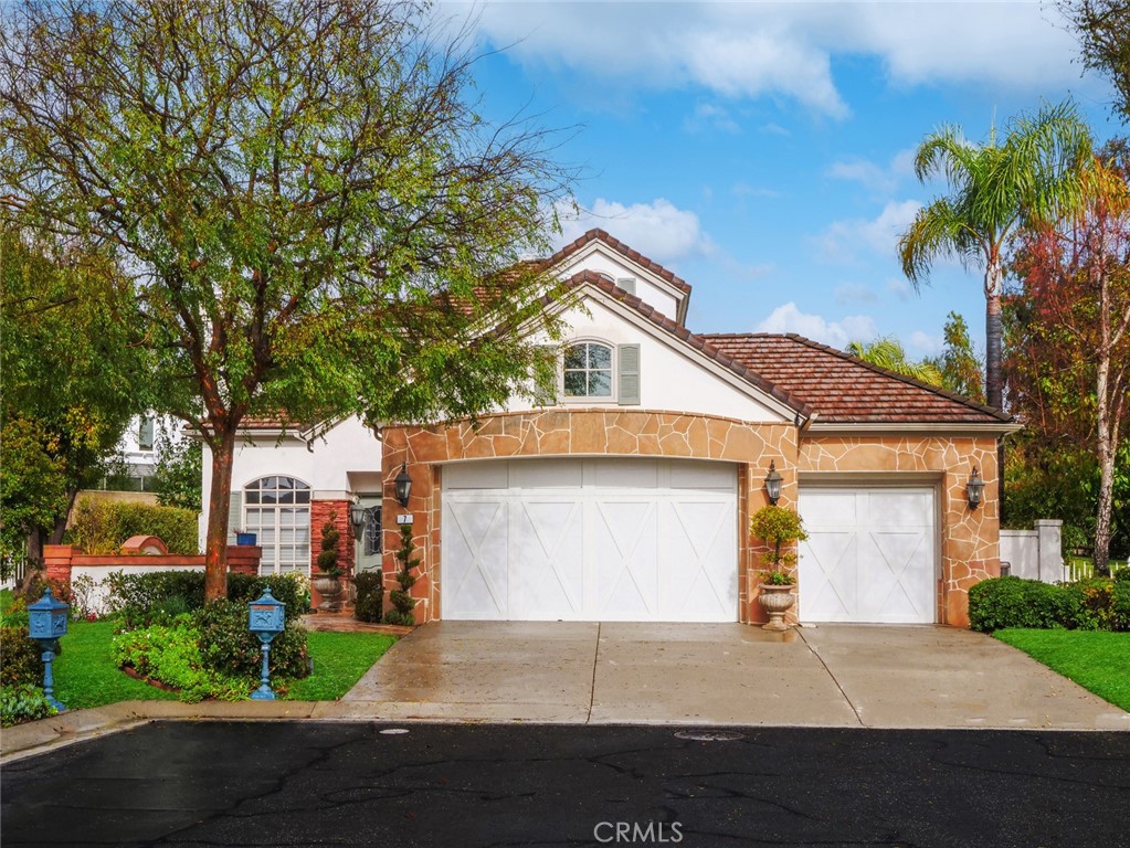 7 Hillcrest Meadows Rolling Hills Estates, CA 90274 - Photo 2 of 49 a front view of a house with a yard and garage