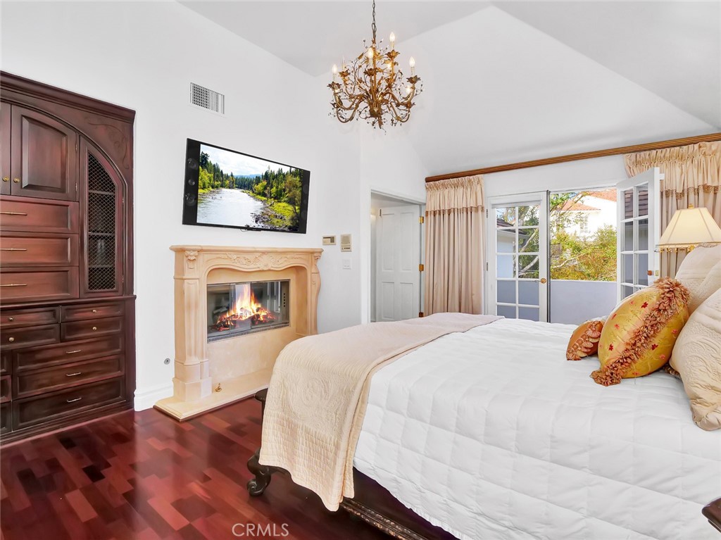 7 Hillcrest Meadows Rolling Hills Estates, CA 90274 - Photo 22 of 49 a bedroom with a bed and a flat screen tv