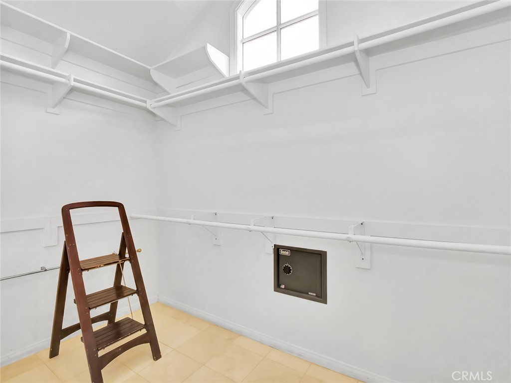7 Hillcrest Meadows Rolling Hills Estates, CA 90274 - Photo 26 of 49 a view of staircase with white walls and wooden floor