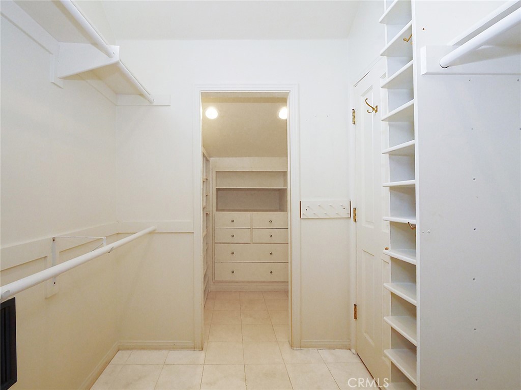 7 Hillcrest Meadows Rolling Hills Estates, CA 90274 - Photo 27 of 49 a view of walk in closet with empty racks