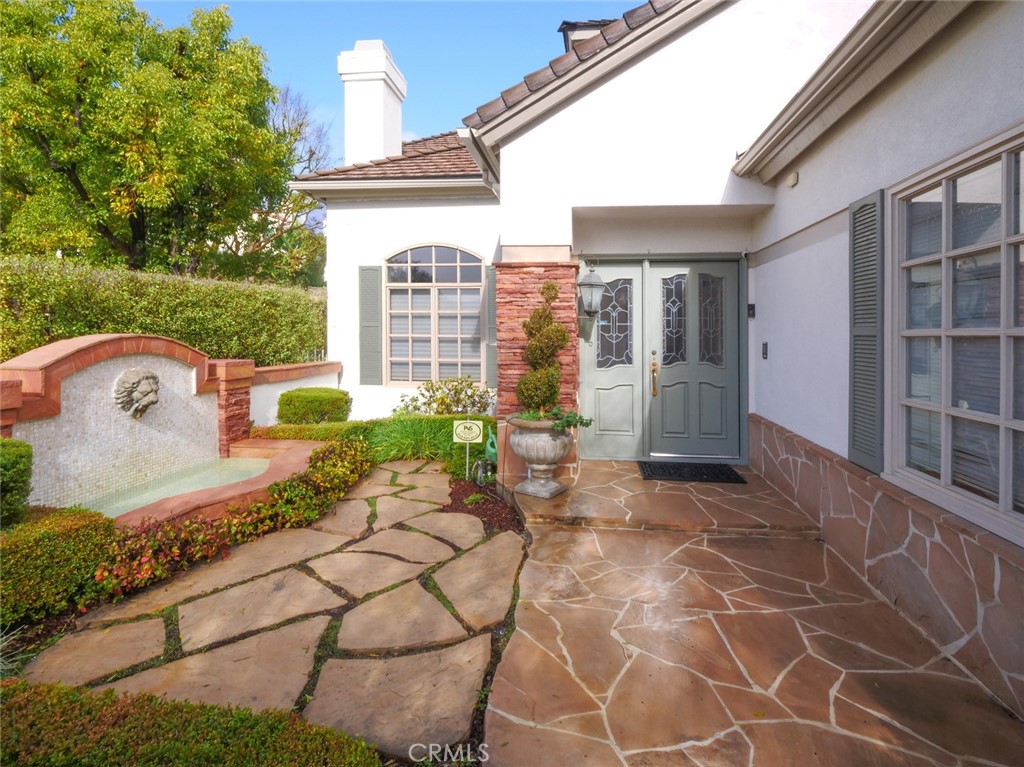 7 Hillcrest Meadows Rolling Hills Estates, CA 90274 - Photo 3 of 49 a view of a patio with table and chairs and potted plants