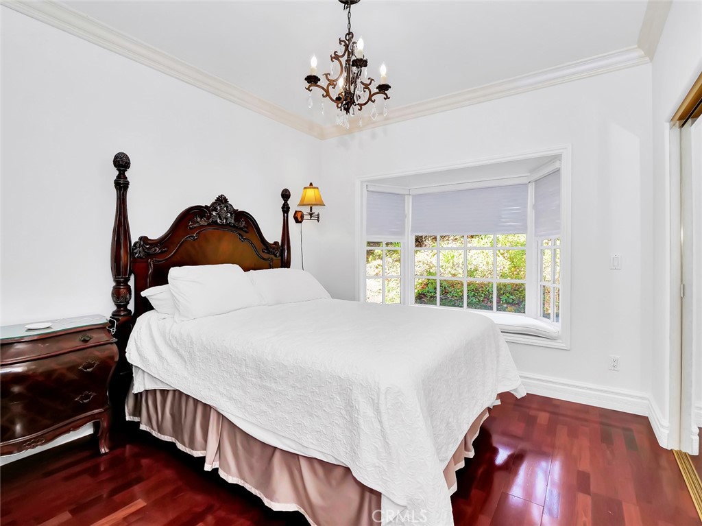 7 Hillcrest Meadows Rolling Hills Estates, CA 90274 - Photo 33 of 49 a bed sitting in a bedroom next to a window